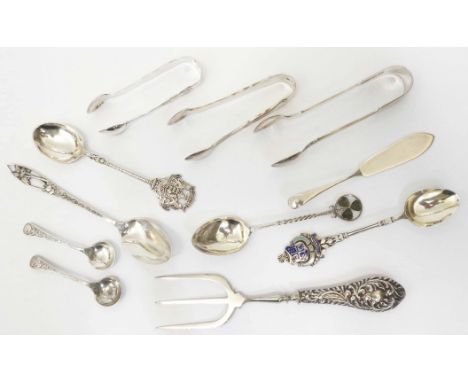 A small collection of English hallmarked silver items including three pairs of sugar tongs, collector's spoons and pair of sa