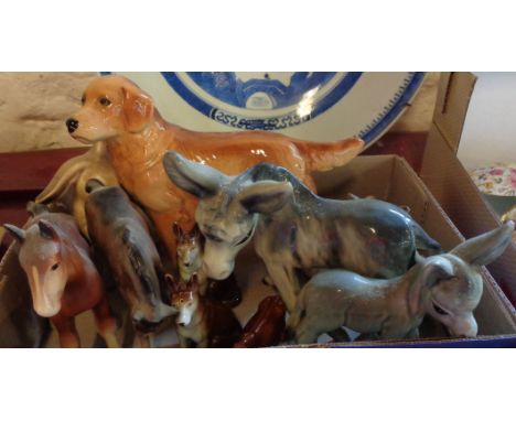 A collection of ceramic animals including Beswick foal with head down, retriever, German Shepherd condiment set, donkeys, Syl