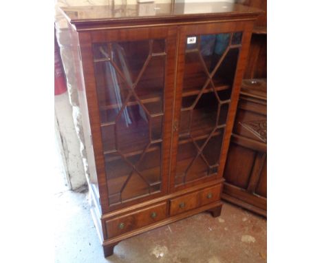 A 30" Bevan Funnell 'Reprodux' mahogany book cabinet with shelves enclosed by a pair of astragal glazed panelled doors, with 