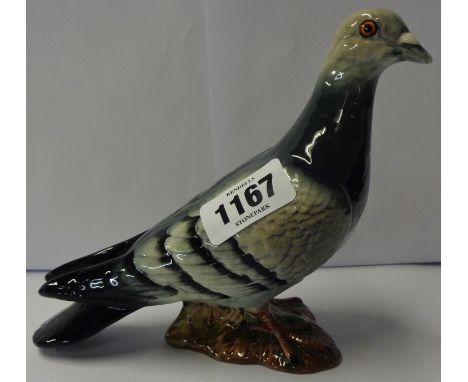 A late 1950's Beswick first type blue pigeon with four stripes to wings and ring to left leg, 1383/1a