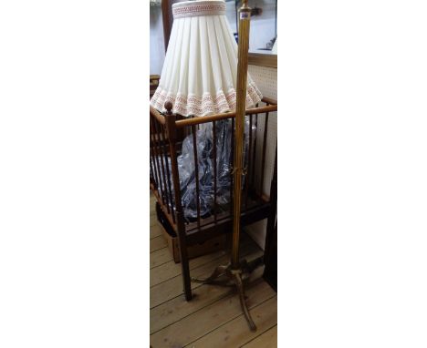 An ornate cast brass standard lamp with reeded column, tripod base and shade - for re-wiring