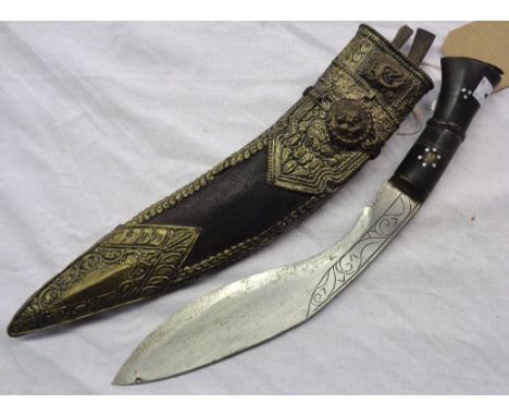 A Nepalese Kothimora kukri with inlaid horn grip in ornate leather clad scabbard with pressed metal decoration, mesh chain, b