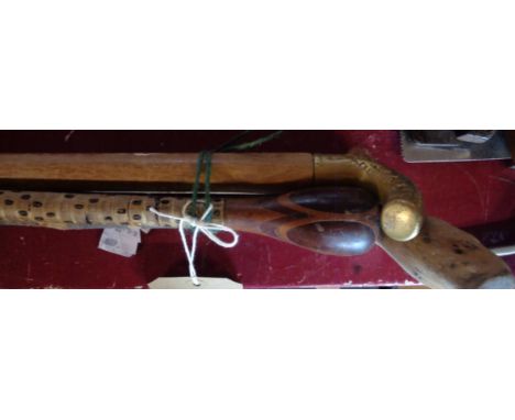 A shark vertebrae walking stick (a/f) and two others