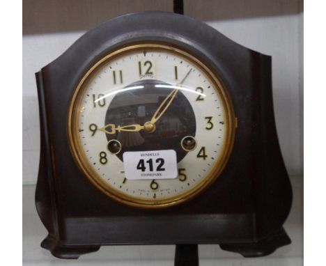 A vintage Smiths brown Bakelite cased mantel clock with eight day gong striking movement