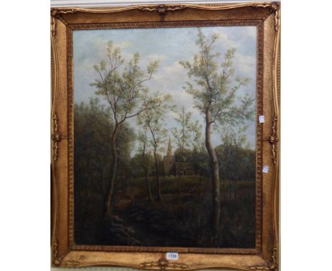 An ornate gilt framed oil on canvas, depicting figures on a woodland track with chapel in background - 29 1/2" X 24 1/4" - ca