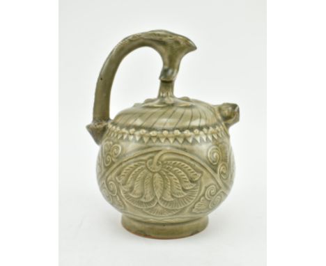 A 20th century Chinese celadon puzzle tea / water pot. The ceramic glazed pot with mythical creature to the handle with repea
