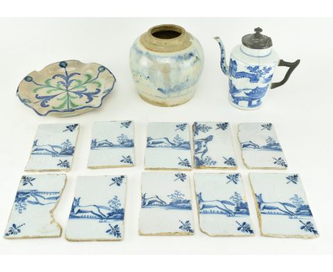 A collection of 18th century and later blue and white ceramics including Delftware tiles. The lot to comprise a pewter handle