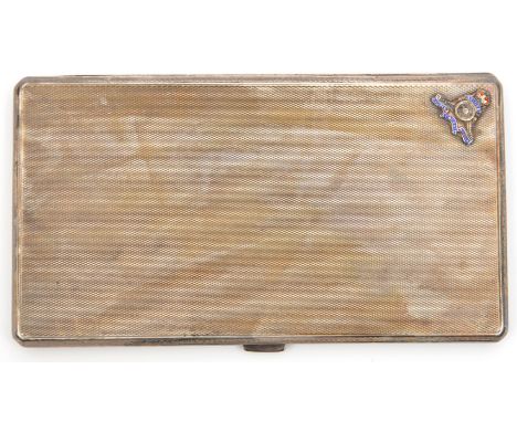 A silver rectangular cigarette case, machine turned finish overall, small enamelled R Artillery badge to top left corner, HM 