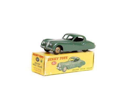  Dinky Toys Jaguar XK120 Coupe (157). An example in dark green with fawn wheels and black rubber tyres. Boxed (correct green 