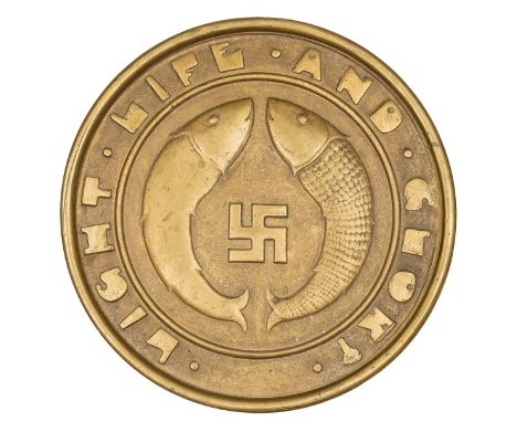 A cast brass unofficial tompion of HMS Emperor of India, battleship 1910-31, showing a swastika (symbol of good fortune) with