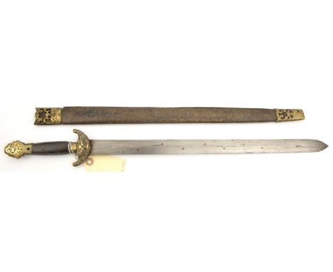 A Chinese sword, blade 17½” inset with copper studs, the hilt with cast brass mounts and plain wood grip, in its brass mounte