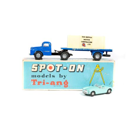 2x Tri-ang Spot-On 1:42 scale vehicles. An Austin Type 503 Normal Control Flatbed Lorry (106a/1c). An example in dark blue wi