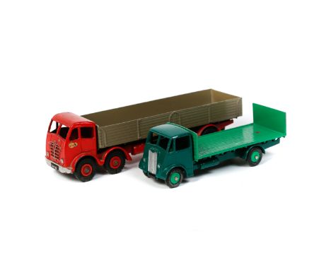 2 Dinky Toys. A Foden wagon (901) with red cab, chassis and wheels and fawn back. Together with a Guy flat truck with tailboa