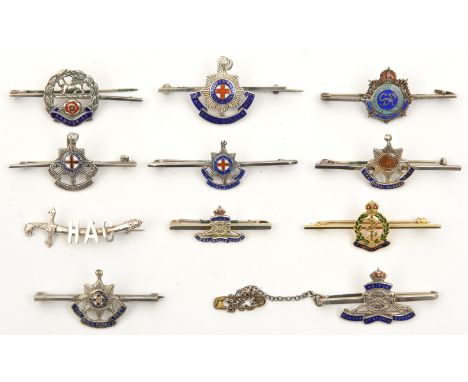 7 enamelled silver sweetheart tie pins:  RA (2), Geo VI RE, R Sussex (3) and Hampshire; non enamelled HAC; all marked “silver