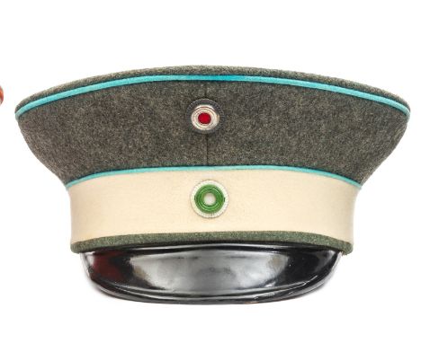 An Imperial German Saxon Garde Reiter officer’s war service pattern peaked cap (feldmutze), with grey crown, white band, ligh
