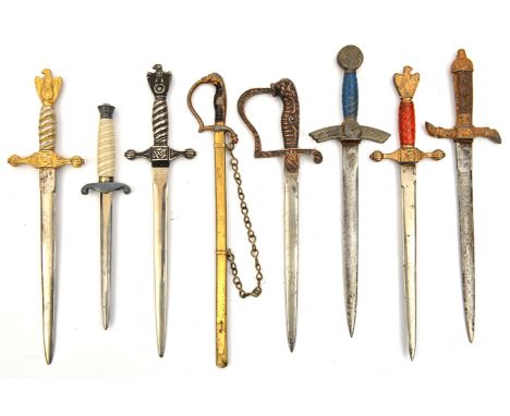 A miniature Third Reich Army officer’s dagger/paper knife,  6” overall (blade has been filed); 3 post war naval officer’s and