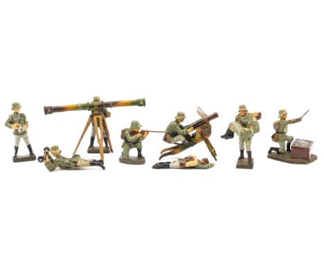 9 Elastolin German Army figures. 2 with range finders, large and small, soldier with wounded soldier, soldier with heavy mach