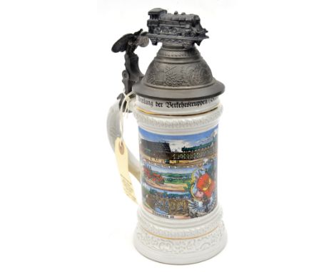 A post war German decorated beerstein, bearing coloured scenes of Imperial German railway troops and the dates 1907-1909, the