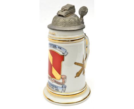 An American souvenir of Germany glazed beer stein, colour decorated with the badge of the “2nd Howitzer Bn. 27th Arty” over “