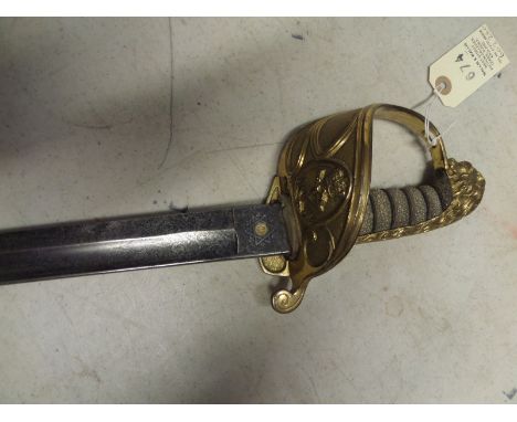 A Vic RN officer’s sword, slightly curved, fullered blade 31½” by E&amp;W Seagrove, Hard, Portsea, etched on one side with cr