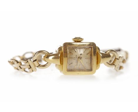 LADY'S OMEGA EIGHTEEN CARAT GOLD MANUAL WIND COCKTAIL WATCHsigned Omega movement, the square champagne dial with applied bato