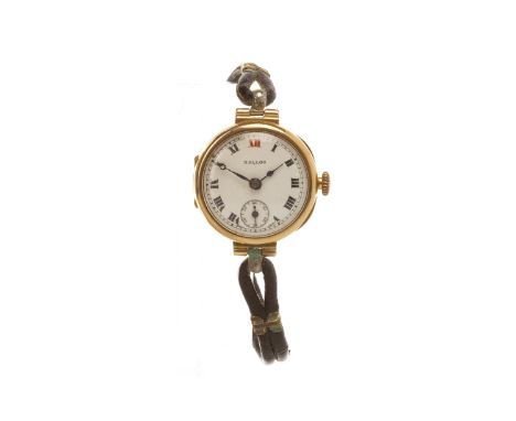 LADY'S EARLY TWENTIETH CENTURY NINE CARAT GOLD MANUAL WIND WRIST WATCHthe round white enamel dial with NALLOG, with Roman num