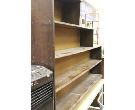 A mahogany four-shelf bookcase of stepped form, to a plinth base