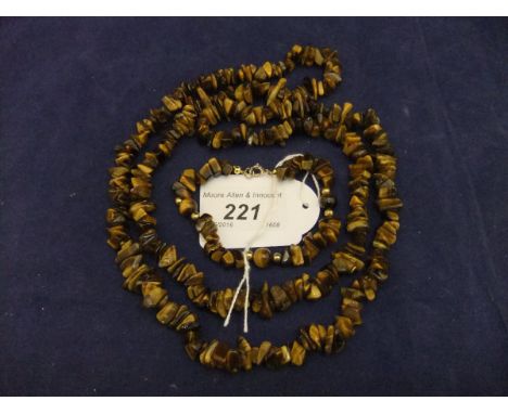 A tiger's eye necklace and similar bracelet, together with another tiger's eye necklace with arrow head shaped pendant, and a