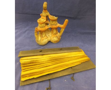 A 19th Century Middle Eastern palm leaf manuscript, an early Chimu style painted terracotta three section puzzle jug and a Mi