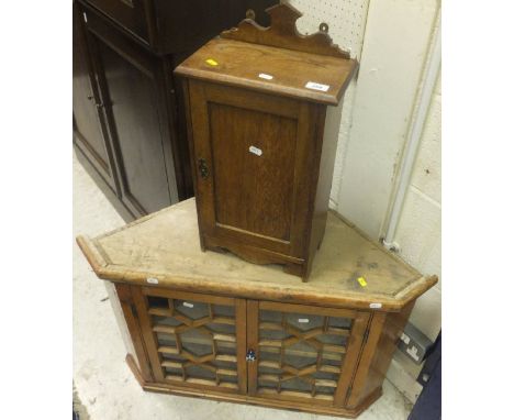 A small oak cupboard with single panelled door opening to reveal single shelf and a 19th Century pine corner cupboard, the tw