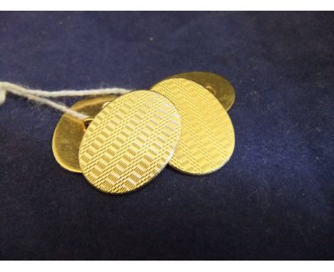 A pair of 18 carat gold cufflinks with engine turned decoration  CONDITION REPORTS Approx 9.6g total. Some light scratches th