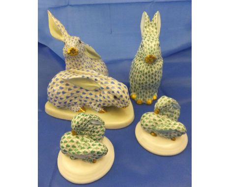 A Herend porcelain figure group of two rabbits decorated in blue on a white ground, a Herend porcelain figure of a seated rab