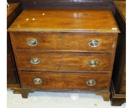 A 19th Century mahogany chest of three long graduated drawers, to ogee bracket feet