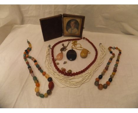 A box containing a collection of jewellery and decorative items comprising a 19th Century miniature portrait of a girl wearin