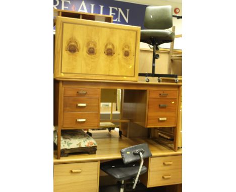 Two teak desks, three leatherette covered office chairs, a maple effect sideboard of four doors to plinth base, a walnut fram