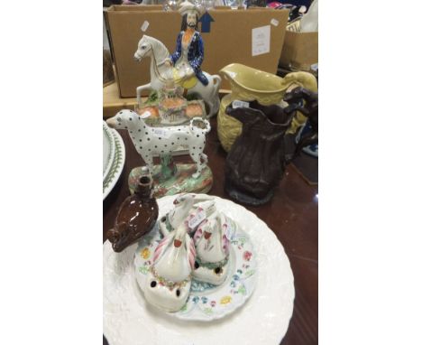 A collection of Staffordshire and other wares to include a 19th Century Staffordshire figure of a dalmatian, 19th Century Pra