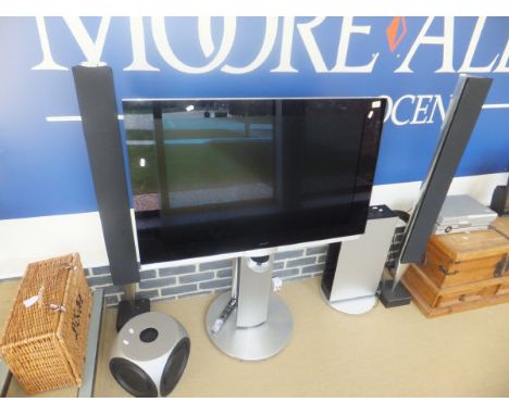 A Bang & Olufsen flatscreen pedestal television, pair of pedestal line speakers, CD player, BeoLab 2 Type 6862 speaker, CD ra