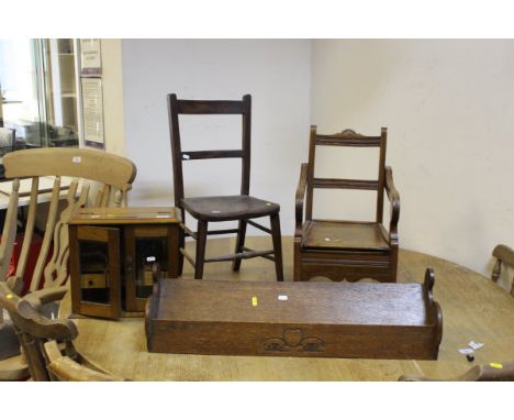 A 19th Century beech and elm child's commode chair, a 19th Century beech and elm child's stick back chair, a small oak smoker