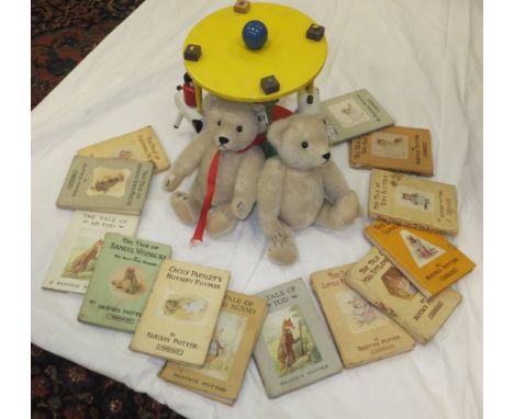 A box containing a collection of children's toys to include wooden merrygoround, a selection of soft toys to include two Stei