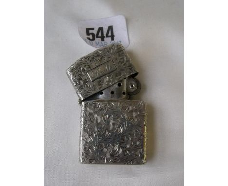An American petrol lighter with scroll engraved  case 2” high marked sterling      
