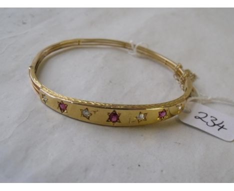 A heavy diamond & ruby 15ct hinged  bangle 9.2g        
