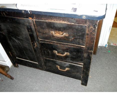 An enamel top kitchen cabinet