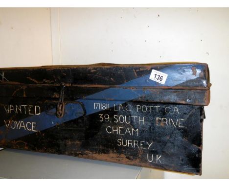A metal shipping trunk