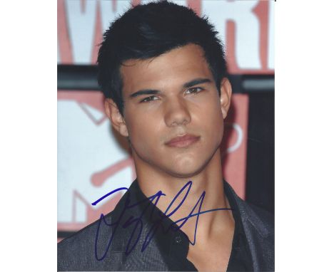 Taylor Lautner signed 10 x 8 colour photo. He is known for playing Jacob Black in The Twilight Saga film series based on the 