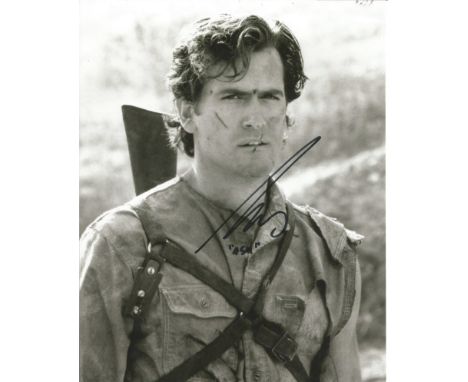 Bruce Campbell The Evil Dead hand signed 10x8 photo. This beautiful hand signed photo depicts Bruce Campbell as Ash in the hi