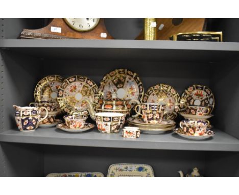 A selection of Royal Crown Derby 2451 Imari pattern teawares, to include a teapot, plates, cups, saucers.
Wear to gilding, da