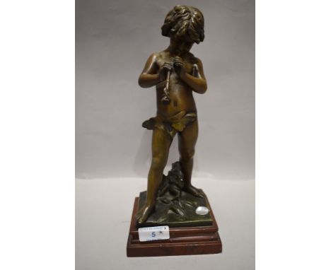 After Jean Louis Gregoire, A 19th century French Zamak figurine depicting a young boy playing a flute.AF.