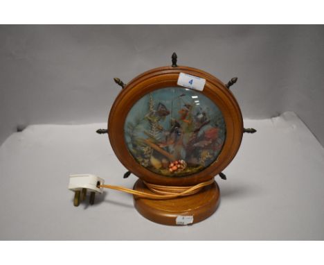 A mid century kitsch style sea side theme lamp having light up underwater scene