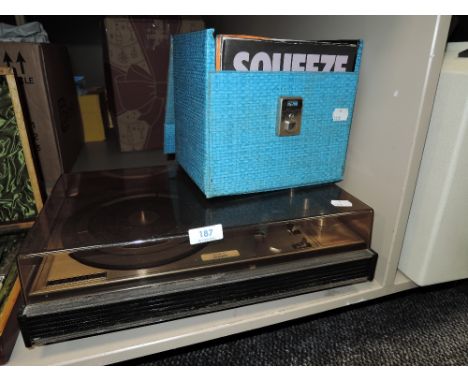 A French made 1556 stereo vinyl record player with a box of 7inch singles