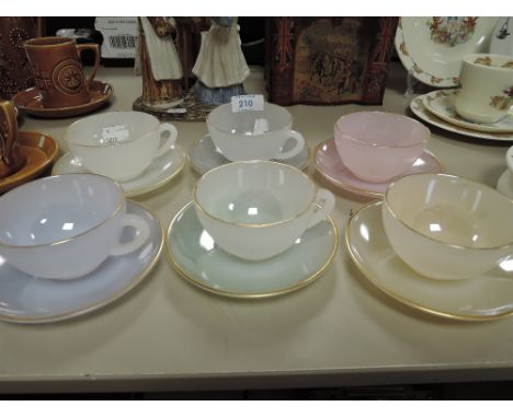 A set of Arc Opal harlequin tea cups and saucers